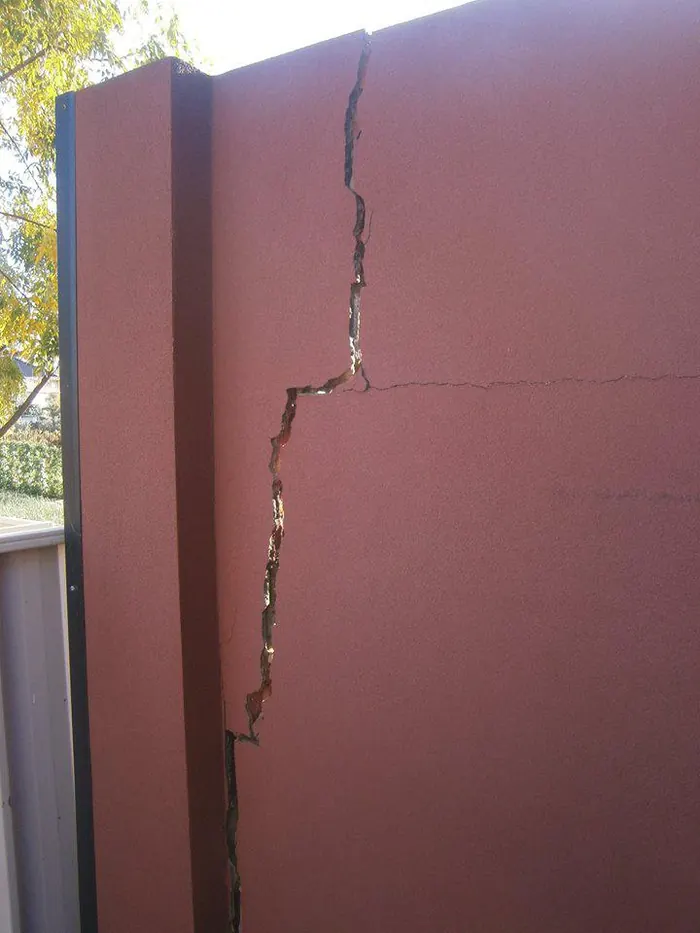 Cracked rendered boundary wall