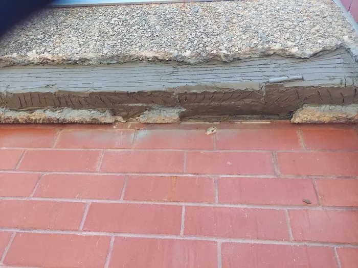 Repair mortar built up in keyed layers