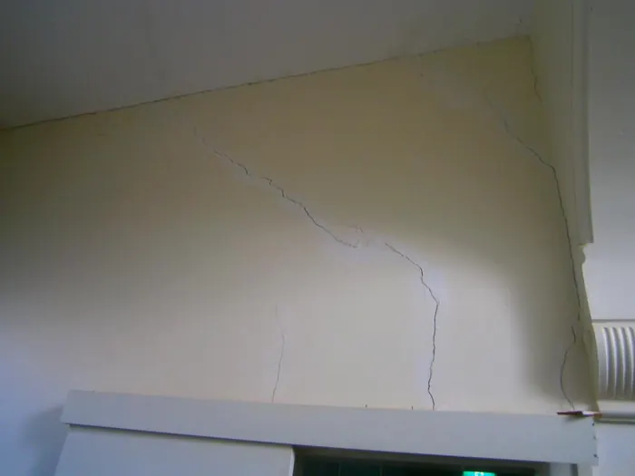 Diagonal crack above a doorway