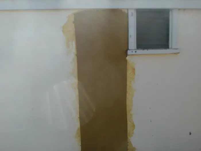 Rendered wall repaired after crack stitching