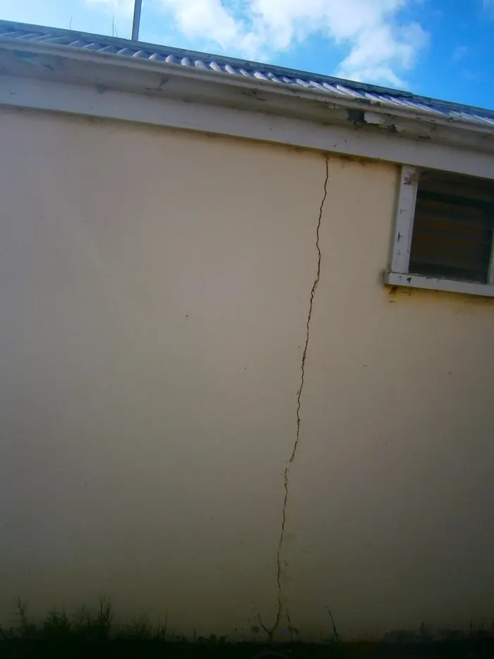 Long vertical crack in a rendered wall